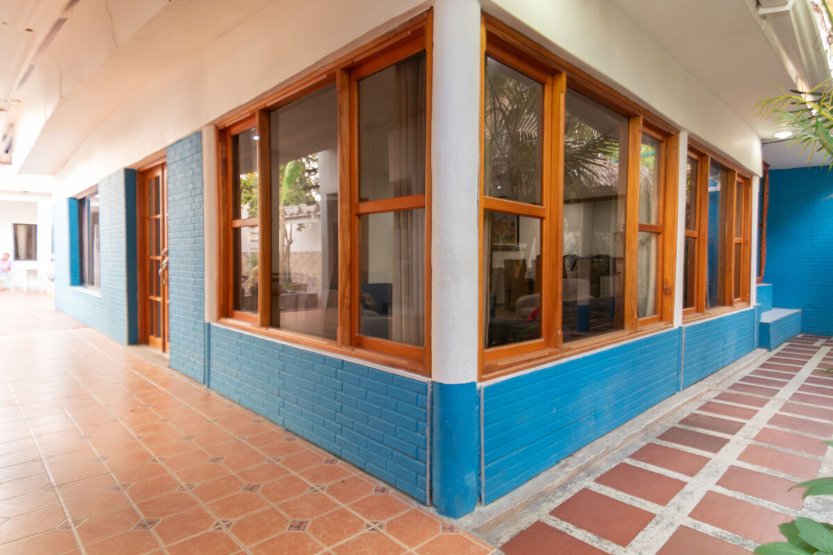 Main house exterior with blue brick